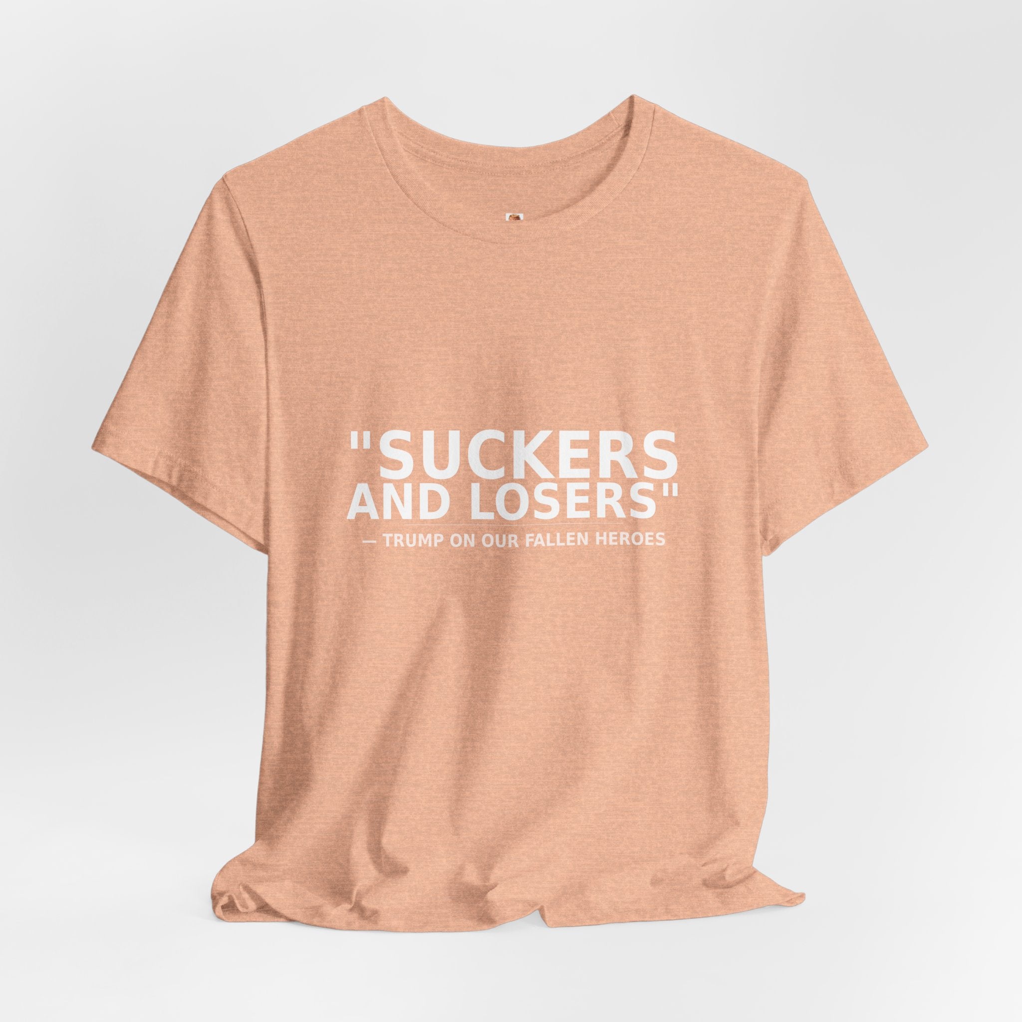 Angled lifestyle view of peach Suckers and Losers anti-Trump military tribute protest t-shirt by Peach2Impeach