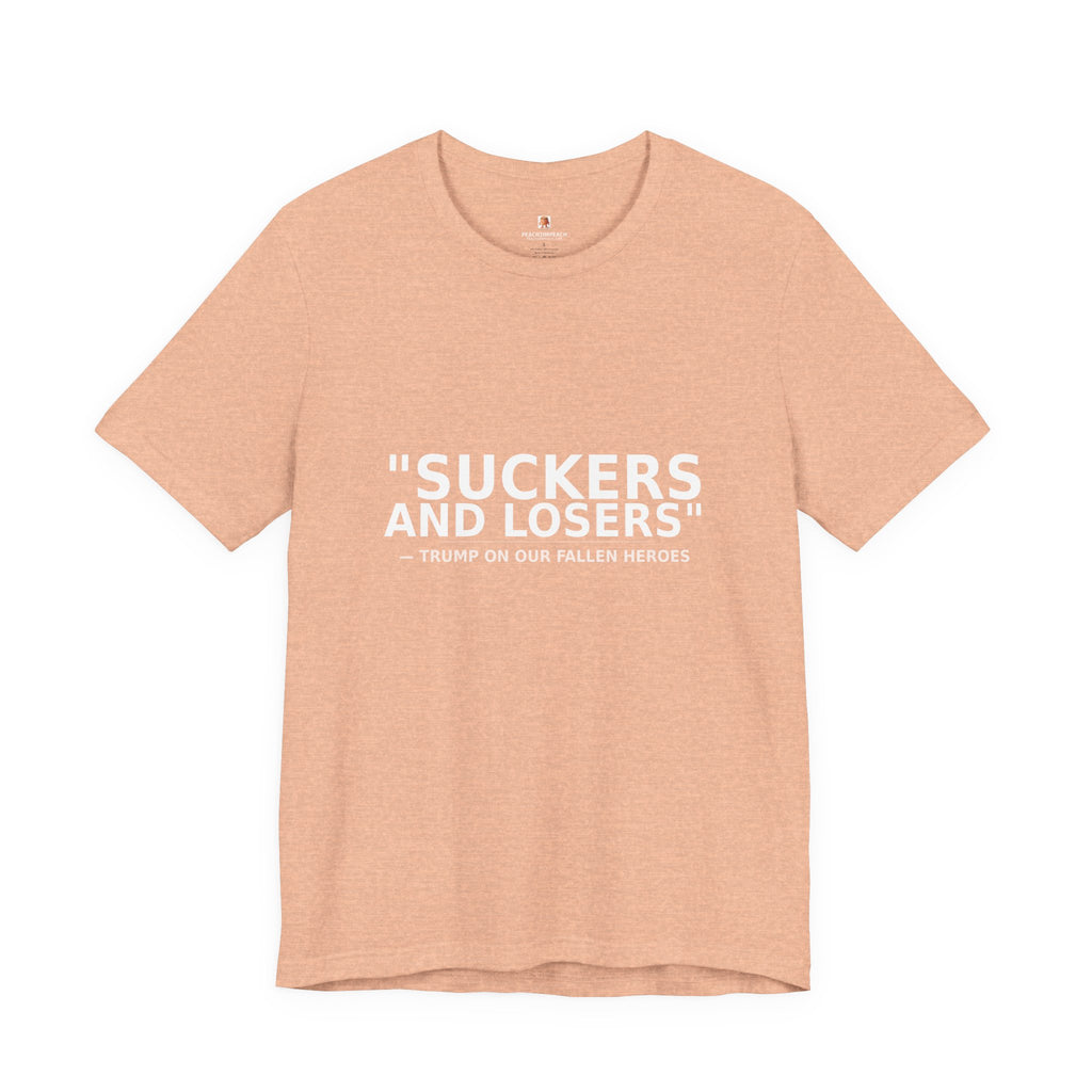 Front view of peach Suckers and Losers t-shirt with white protest text honoring fallen soldiers by Peach2Impeach
