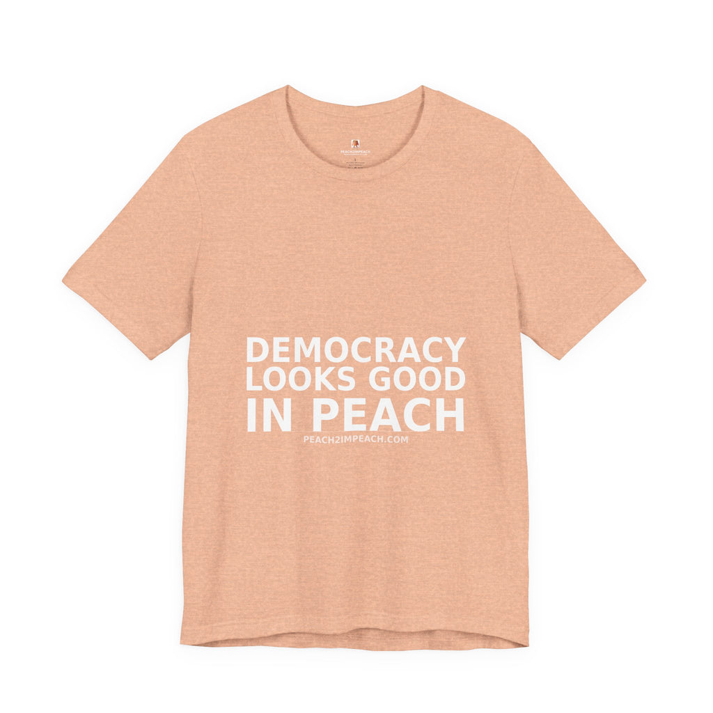 Folded peach Democracy Looks Good in Peach pro democracy political t-shirt by Peach2Impeach