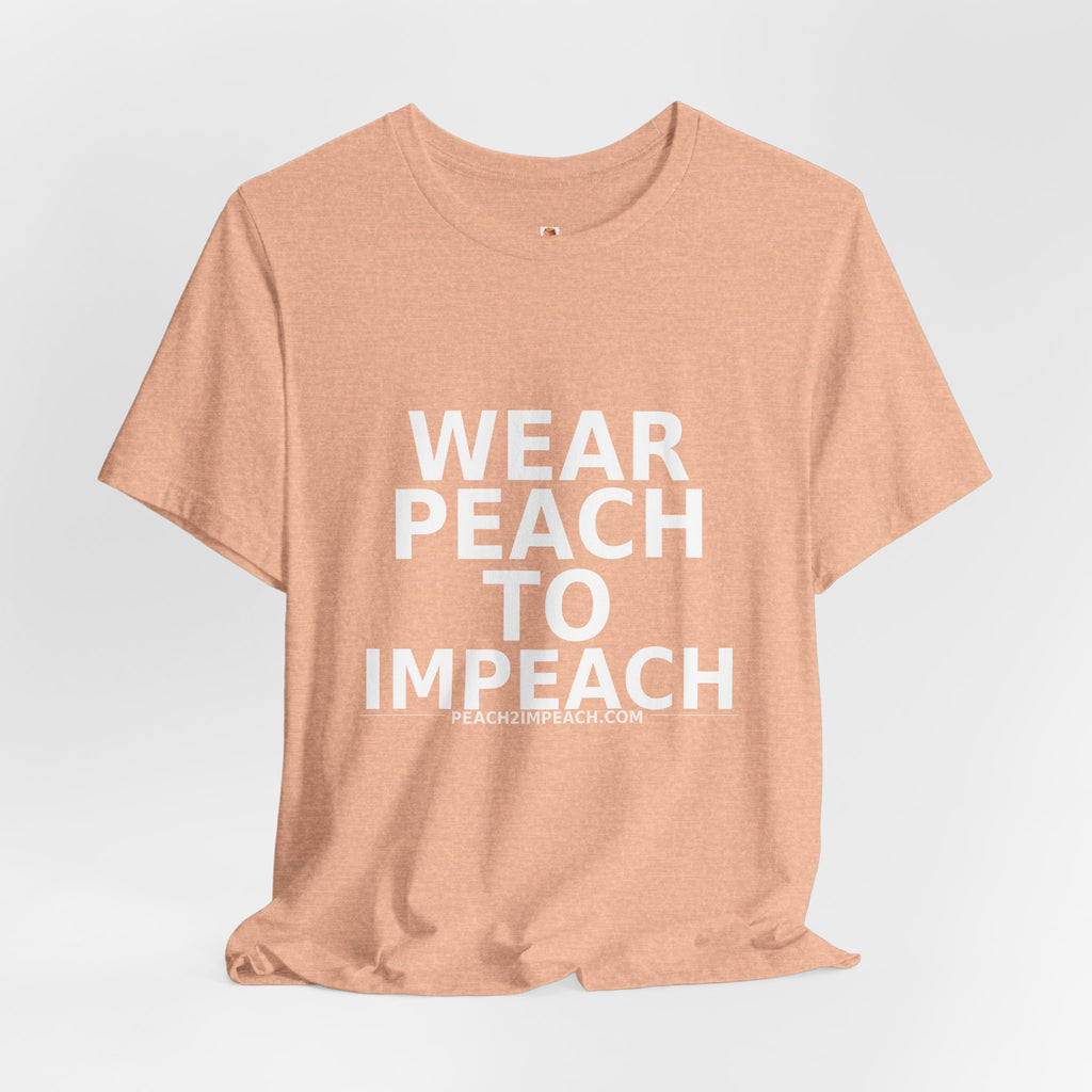 Angled lifestyle view of peach Wear Peach to Impeach political protest t-shirt by Peach2Impeach