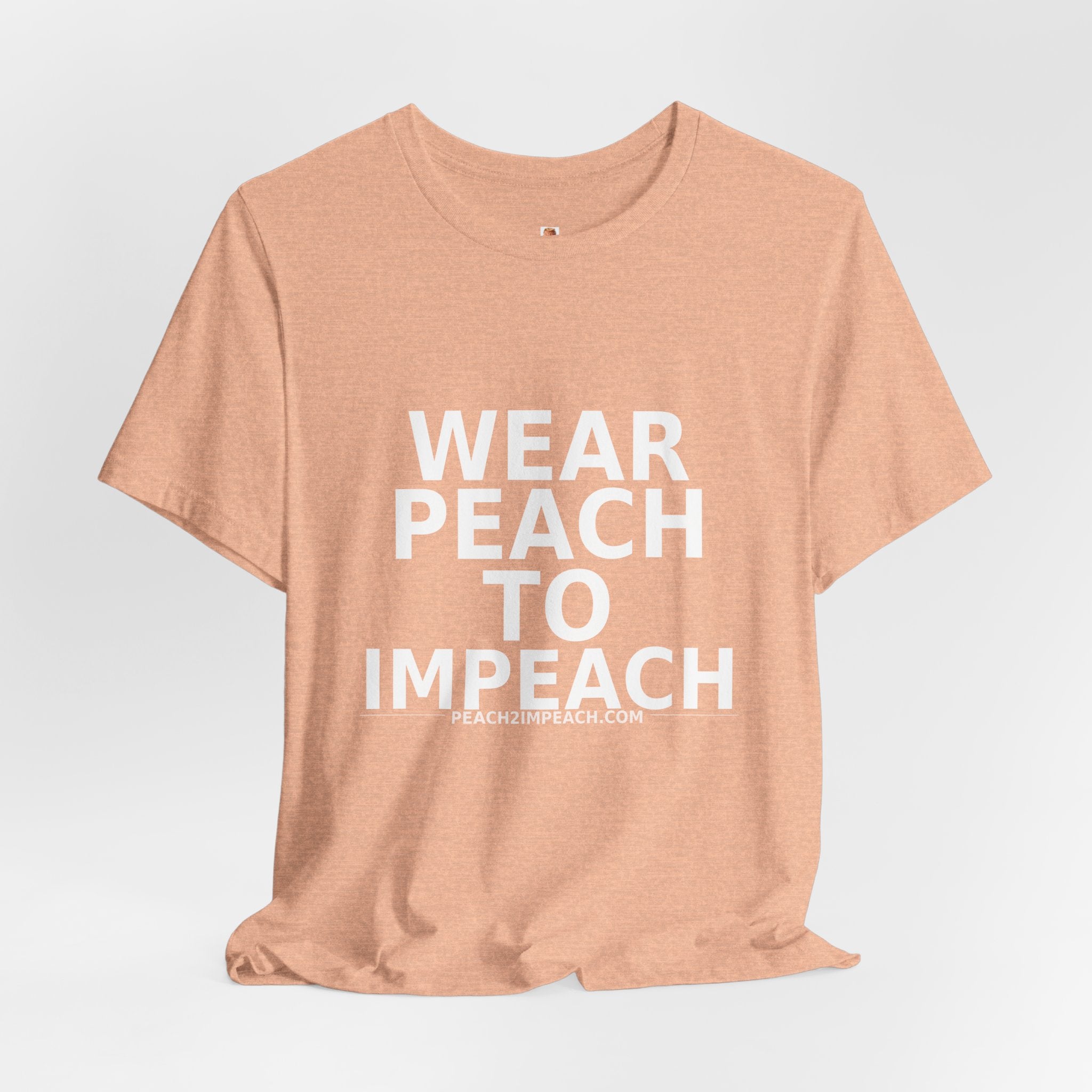 Angled lifestyle view of peach Wear Peach to Impeach political protest t-shirt by Peach2Impeach